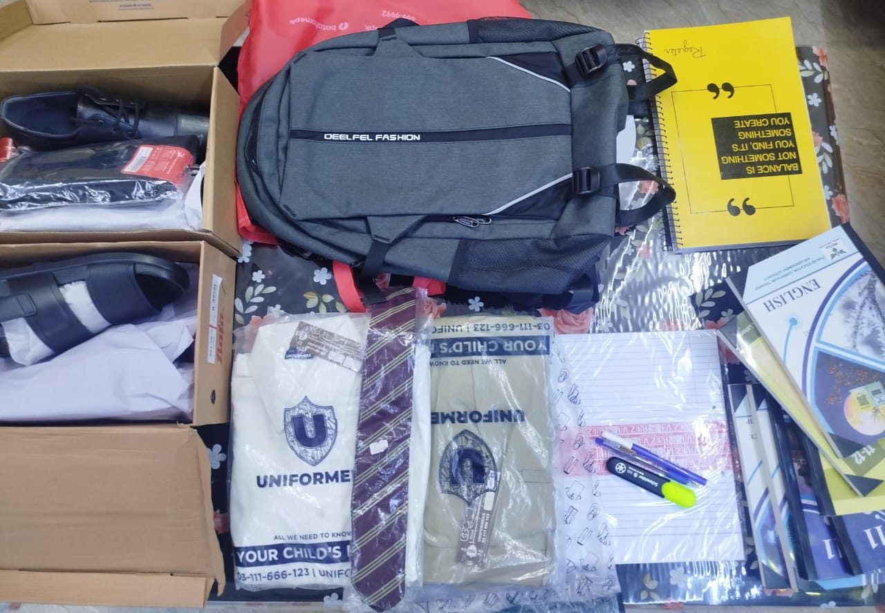 A complete back-to-school kit — bag, uniform, shoes and books